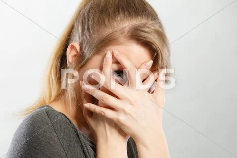 Shy girl hiding her face. Stock Photos