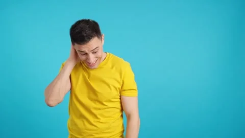 A shy man gesturing and looking away Stock Footage 244082086