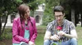 a shy man gives a red rose to a beautiful woman - love - lover- fond - kiss HD Footage