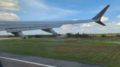 SIA plane right wing take off runway dark to bright Stock Footage 224805791