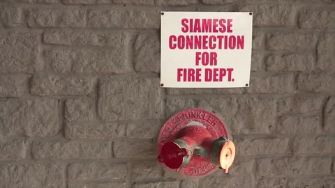 Siamese connection for fire dept department writing caption text square white Stock Footage 250280930