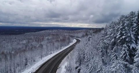  Siberian taiga.Road in the winter forest. Aerial View. Video stock 81163660
