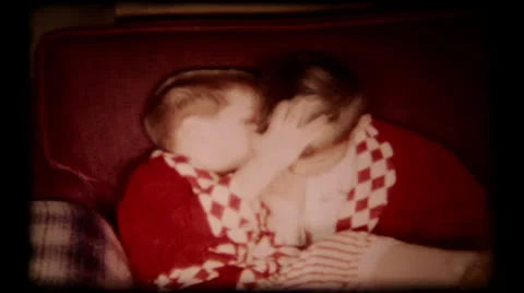 Sibling brothers kissing each other at home  1950s vintage home movie  53 Stock Footage 25792580