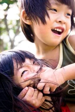 Sibling playing Stock Photos