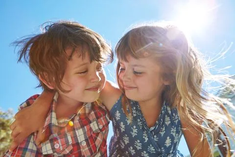 Sibling sentiment. an affectionate brother and sister embracing in their Stock Photos