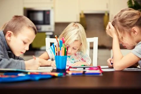 Siblings are doing his homework for elementary school. Foto stock