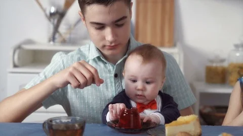 Siblings eating sweets together Stock Footage 73096358