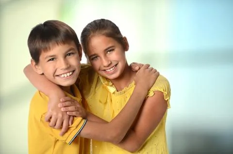 Siblings embracing Stock Photos
