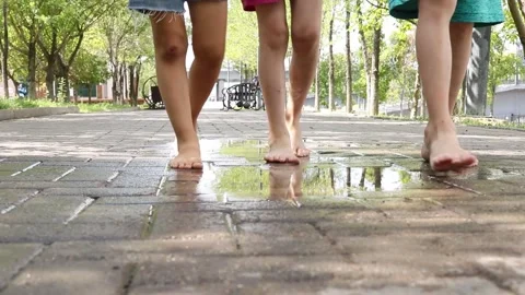 Siblings in the park walking with bare soles Stock Footage 158566687