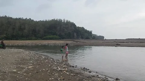 Siblings playing at the beach Stock Footage 257041694