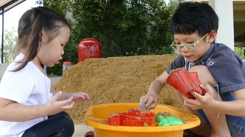 Siblings playing sand at home Stock Footage 71165109