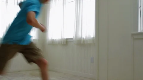 Siblings running indoors. 스톡 동영상 88367672