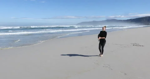 Siblings walking on beach, Walker Bay Nature Reserve, Western Cape, South Africa Video stock 202959157