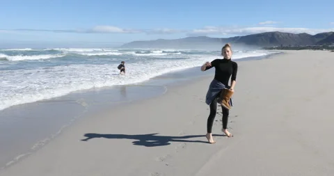 Siblings walking on beach, Walker Bay Nature Reserve, Western Cape, South Africa Video stock 202962896