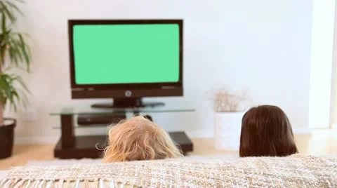 Siblings watching the television Stock Footage 10815335