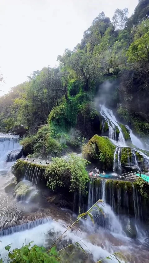 Sichuan, China - January 4, 2026 Tourists bathing in the famous Luoji Mounta Video stock 325640153