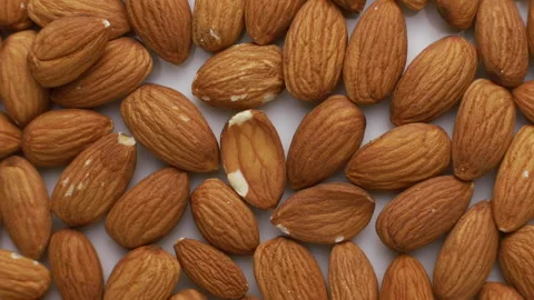 Sicilian almonds on a turntable Stock Footage 149380591