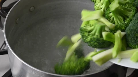 Sicilian broccoli begin cooking in pot of boiling water. Stock Footage 146600042