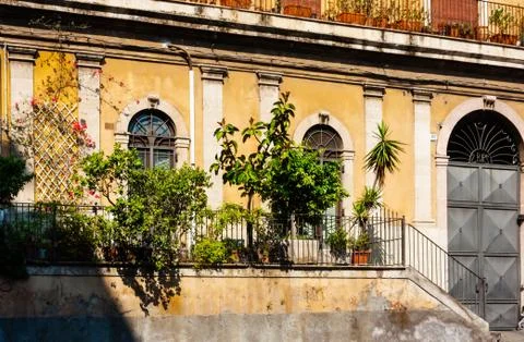 Sicily, facade of old baroque building in Catania, old street with traditiona Stock Photos