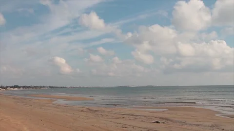 Sicily italy beach sand with bright sun shining wide shot with clouds sky empty Stock Footage 252152306