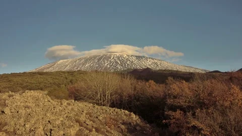 Sicily time lapse low clouds roll on Etna Mountain shadows moving old lava  Vídeos de archivo 146770536
