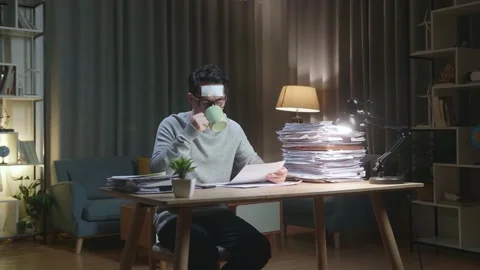 Sick Asian Man Drinking Water While Working Hard With Documents At The Home Stock Footage 196876216