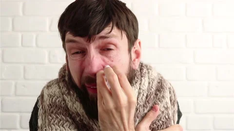 Sick bearded man shivering feeling cold close up Stock Footage 150109727