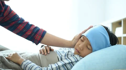 Sick boy on the bed Stock Footage 61360020