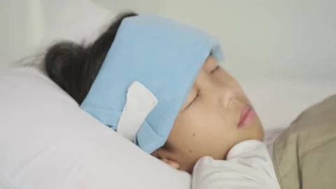 Sick boy on a bed Stock Footage 138722958