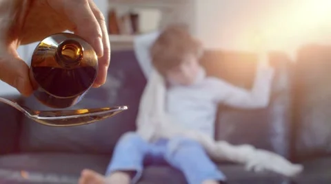 Sick boy does not want to take medicinal syrup Stock Footage 63325188