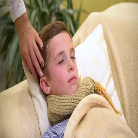 Sick boy, lying in bed, mother checking his temperature Stock Footage 69635069