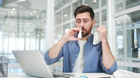 Sick businessman in suffering from cold and runny nose while sitting  Stock Footage 305693338