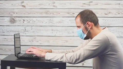 Sick businessman use laptop computer with temperature and headache working in Видео 105462525