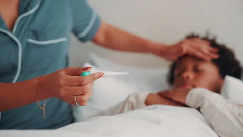 Sick child, home and hands with thermometer in bedroom, forehead check and Stock Footage 338395576