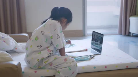 Sick child learning online class with teacher and friend at hospital Stock Footage 287896086