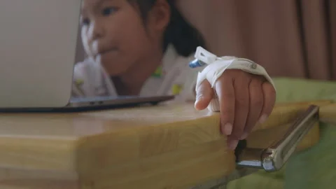 Sick child learning online class with teacher and friend at hospital Stock Footage 287896292
