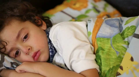 Sick child lying in bed Stock Footage 44394254