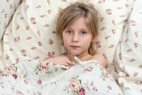 Sick child measures the temperature Stock Photos