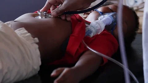Sick child with oxygen mask Stock Footage 69256456