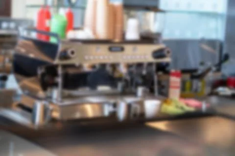 Sick coffee machine with mugs in a cafe. Everything is out of focus Stock Photos