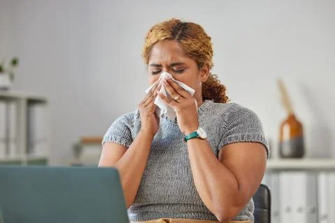 Sick, ill, or unwell business woman suffering with a cold, flu or sinus Stock Photos