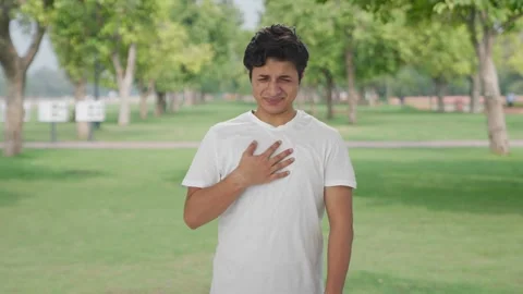 Sick Indian man having acidity problem Stock Footage 252954304