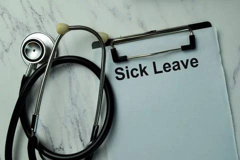 Sick Leave write on a paperwork isolated on office desk. Stock Photos