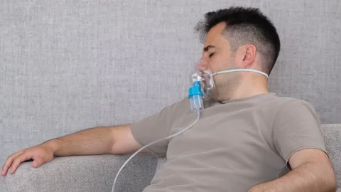 Sick man breathing machine Stock Footage 277152853