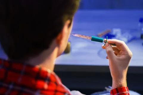 Sick man checking his temperature with a thermometer. Home treatment and re.. Stock Photos