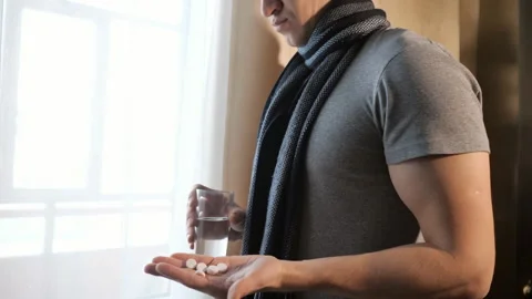 Sick man drinking freh water Stock Footage 100819092