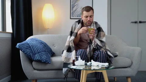 A sick man drinks a cold pill - home treatment Stock Footage 210966153