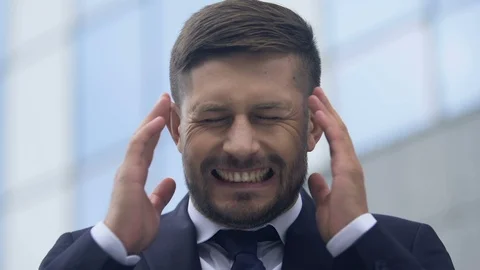 Sick man grimacing from sharp pain in temples, stressful life and stress at work Видео 117222904