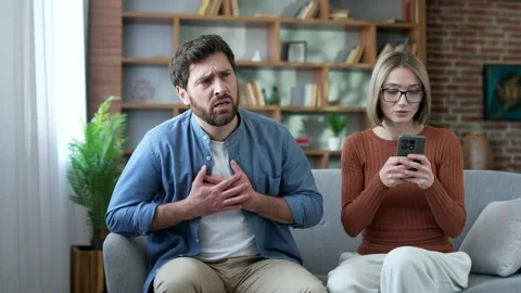 A sick man has a heart attack at home. Wife supports her husband and uses  Stock Footage 337930436