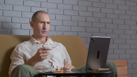 Sick man having online consultation with doctor Stock Footage 324906176